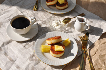 breakfast with black coffee and tasty cheese pancakes