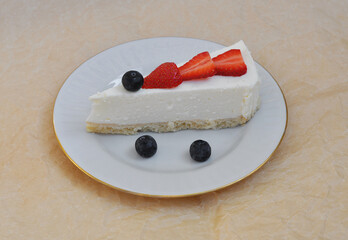 sweet tasty cheesecake with berries on a plate