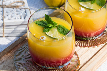 Tequila sunrise coctail on a hot sunny day.