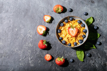 Golden cerials served with strawberry, blueberry