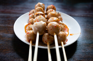 closed-up the pork meatball barbecue with spicy sauce.