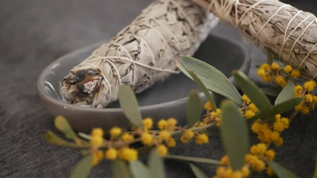 Dried white sage smudge stick, relaxation and aromatherapy. Smudging during psychic occult ceremony, herbal healing, yoga or aura cleaning. Essential incense for esoteric rituals and fortune telling.