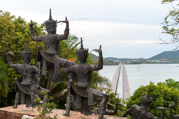 Manora Statue (a kind of Thai-style dancing) facing to the bridge across the lagoon near museun in Songkhla, Thailand