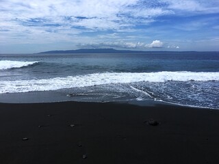 Asian country Indonesia. Bali island. Nusa penida, black sand beach and ocean