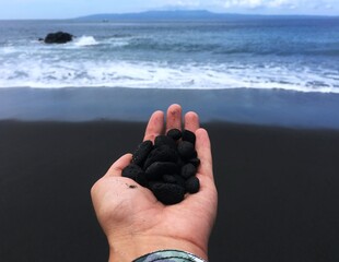 Asian country Indonesia. Bali island. Nusa penida, black sand beach and ocean