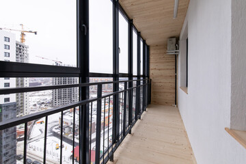 Spacious balcony, solid wood floors and floor-to-ceiling windows