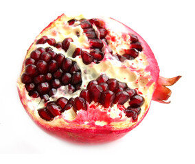 Pomegranate with seeds isolated on a white background.