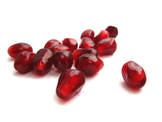 Pomegranate seeds isolated on a white background.