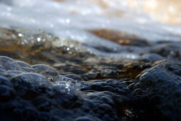 Fast flowing water in the mountain river.