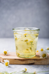 Boozy Long Island Iced Tea with chamomile flowers
