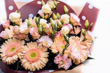 a large beautiful bouquet of delicate pale orange gerberas and roses. flowers for celebration birthday, gift