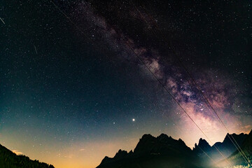 Night photography of the Milky Way and the starry sky, over the Italian Alps mountains....