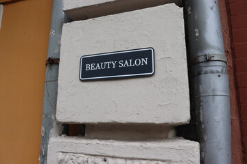 beauty salon nameplate on wall
