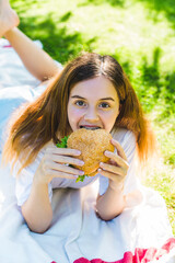 Girl resting in the park on the grass