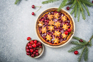 Cherry piecake with fresh cherry. Christmas decotation.