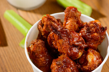 Deep fried chicken drumsticks. Close view on traditional American dish