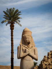 the huge statue of ramses ii is the centrepiece inside karnak temple