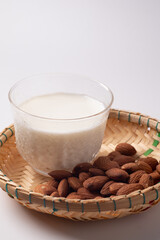 Almond in the cup, white background. Copy area