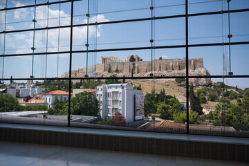 The historic Acropolis in Athens Greece seen through the modern windows of the Acropolis Museum.