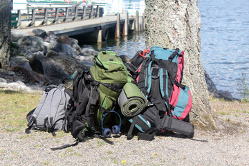 Tourist backpacks on the shore