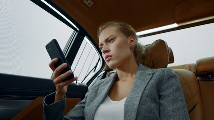 Closeup business woman getting bad news on phone. Sad girl sitting in vehicle © stockbusters