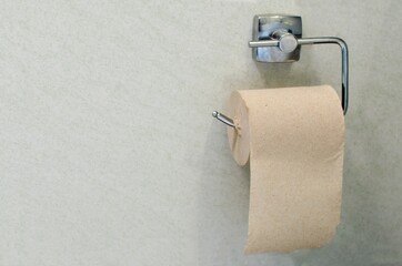 toilet paper roll on white wall