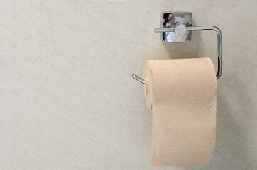toilet paper roll on white wall