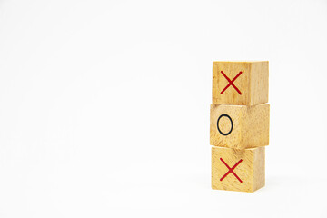 Three layer of wooden square block with O and X character symbol isolated on white background for...