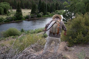 A man fly fishing in the mountains on a wild trout stream.