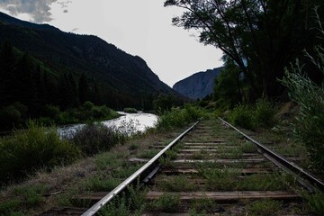 Point of view of a rail road track in the moutons.