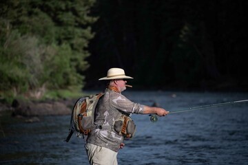A man fly fishing in the mountains on a wild trout stream.