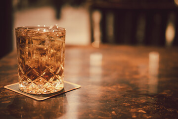 Glass of whiskey with ice