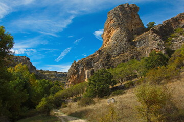 Fototapeta na wymiar Rock formation at the hiking track in park Barranco del Rio Dulce, Guadalajara, Spain 