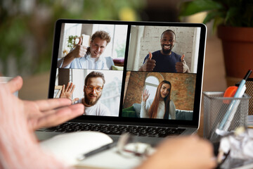 Fototapeta na wymiar Remote meeting. Man working from home during coronavirus or COVID-19 quarantine, remote office concept. Young businessman, manager in front of monitor during online conference with colleagues and team