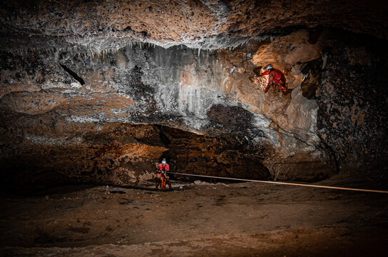 Man Standing On Rock In Cave