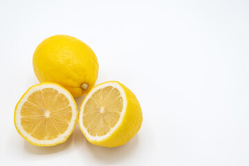 Yellow lemon fruit with a white background,.Isolate and copy space for text and design,Lemon is a citrus fruit with high vitamin C, Lime can be cooking for food and dessert.