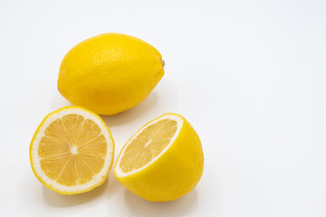 Yellow lemon fruit with a white background,.Isolate and copy space for text and design,Lemon is a citrus fruit with high vitamin C, Lime can be cooking for food and dessert.