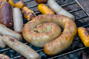 assorted meat sausages on the barbecue gril