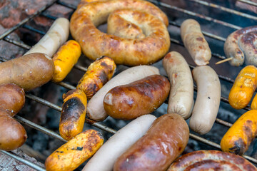assorted meat sausages on the barbecue gril