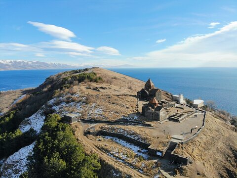 Sevan Lake and Sevanavank oldest church. Mountains country Armenia. Aerial view from above by drone.