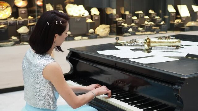 Girl playing at the piano