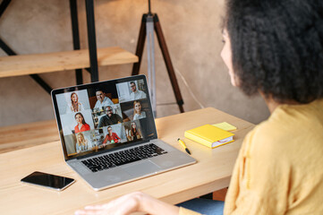 Virtual conference, online meeting. Mixed-race businesswoman using laptop app for communicating...