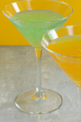 Several glasses of various delicious fruit non-alcoholic cocktails on a bright background. Health drinks
