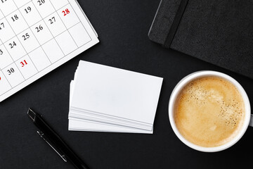Top view of cup with espresso and white business card template