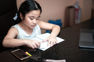 
Girls are learning through the internet at home.