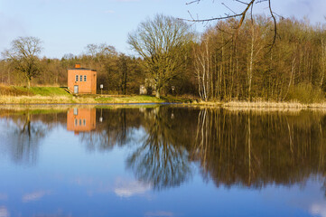 Lake house. Water pump station on the river Bank.