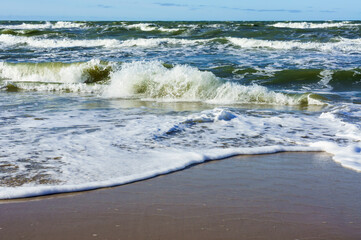 Sea coast. Tides and storms at sea. Waves on the Baltic Sea. Deserted seashore.