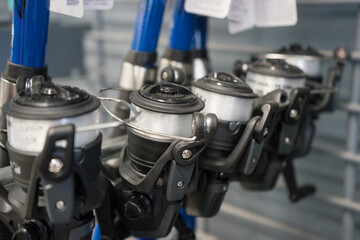 Fishing Rod, spinnings reels in the store. Close-up photo