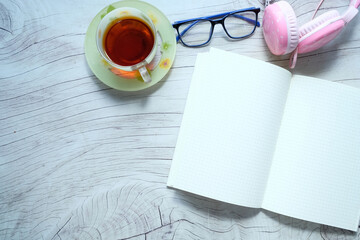 back to school concept open notepad, headphone on table 