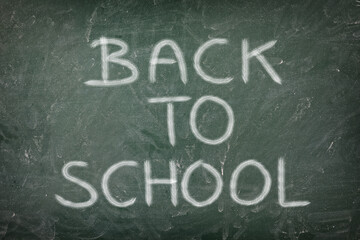  back to school message on green blackboard